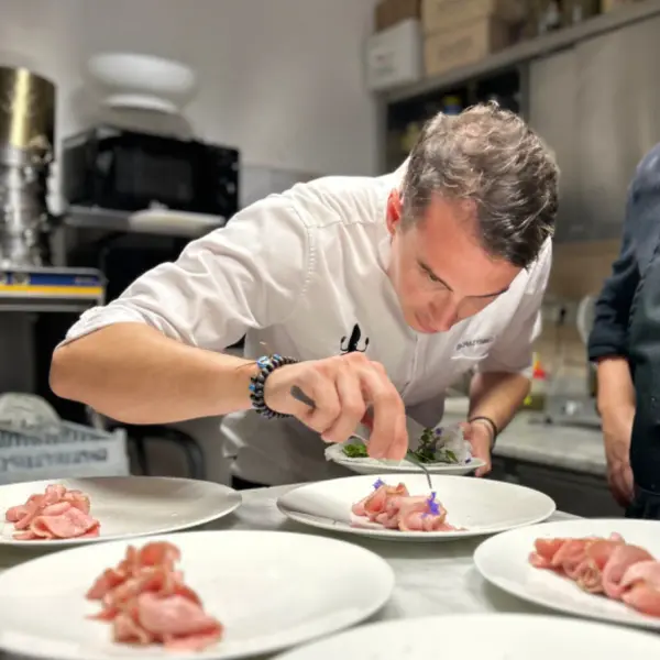 A chef plating a dish